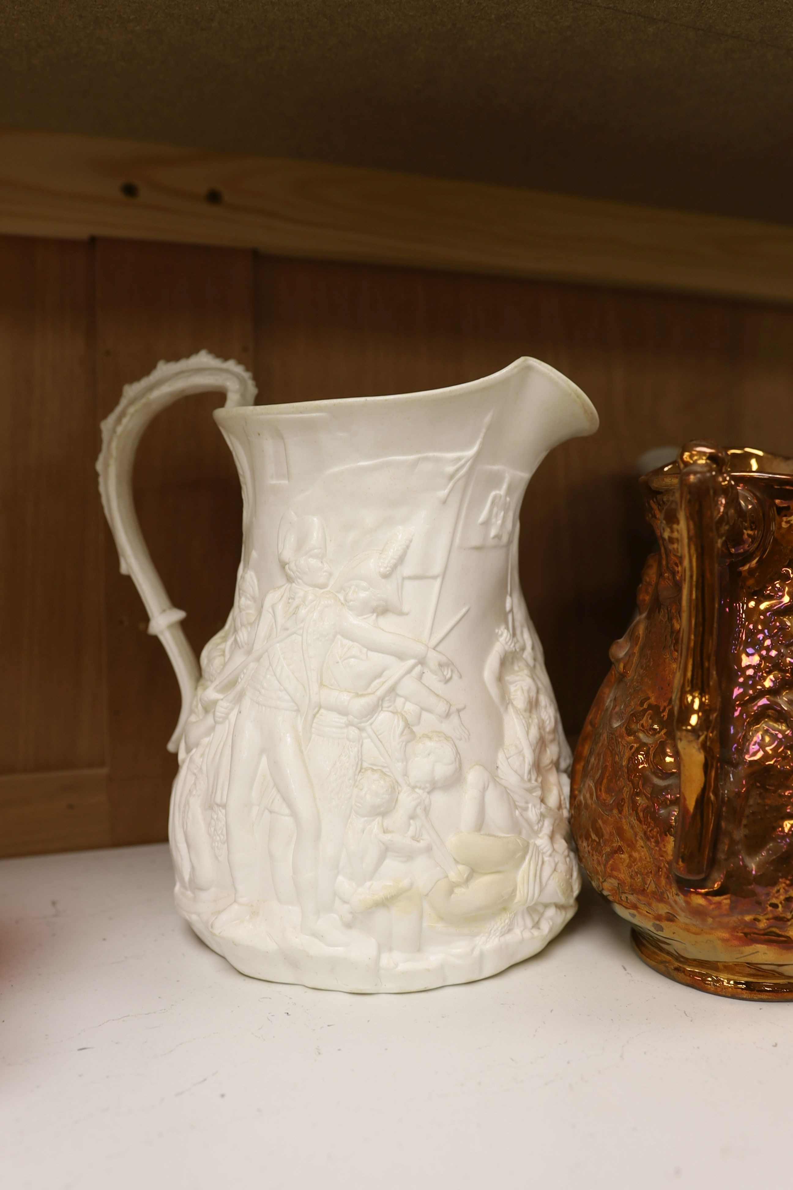 Eight Victorian relief moulded earthenware jugs relating to historic battles and the military